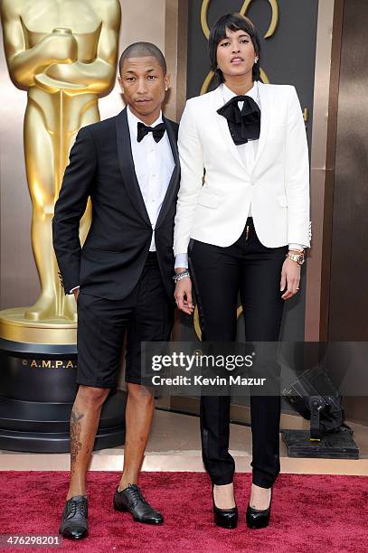 Musician Pharrell Williams and Helen Lasichanh attend the Oscars held at Hollywood & Highland Center on March 2, 2014 in Hollywood, California.