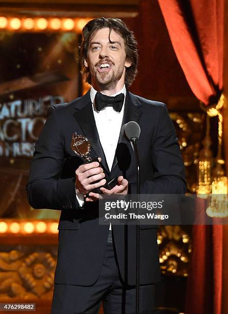 Actor Christian Borle accepts the award for Best Performance by an Actor in a Featured Role in a Musical for Something Rotten onstage at the 2015...