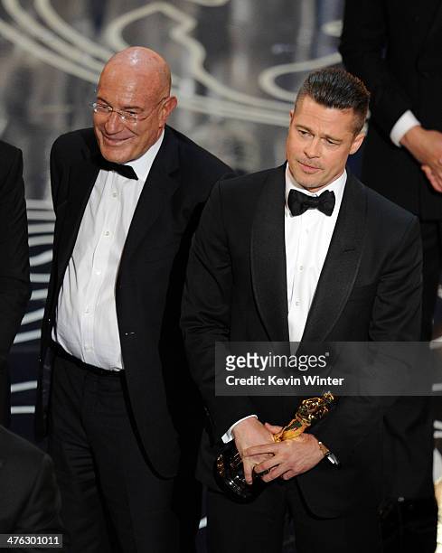 Producer Arnon Milchan and actor/producer Brad Pitt accept the Best Picture award for '12 Years a Slave' onstage during the Oscars at the Dolby...