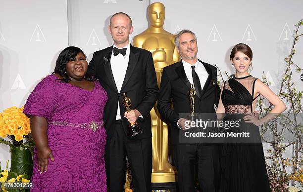 Actress Gabourey Sidibe, editor Mark Sanger, director Alfonso Cuarón, winners of Best Achievement in Editing, and actress Anna Kendrick pose in the...