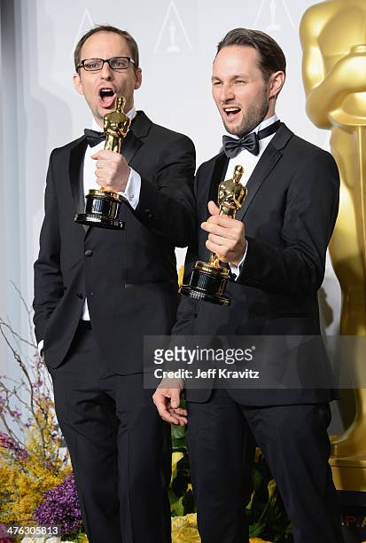 Film maker Laurent Witz and producer Alexandre Espigares pose in the press room during the Oscars at Loews Hollywood Hotel on March 2, 2014 in...