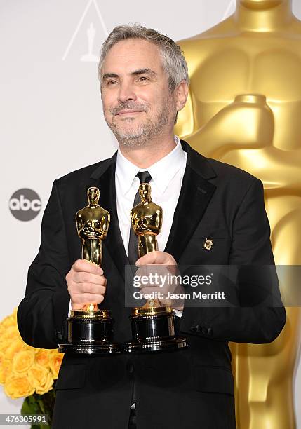 Director Alfonso Cuarón, winner of Best Achievement in Directing poses in the press room during the Oscars at Loews Hollywood Hotel on March 2, 2014...