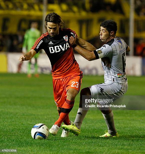 Leonardo Ponzio of River Plate fights for the ball with Nestor Moiraghi of Olimpo during a match between Olimpo and River Plate as part of 15th round...