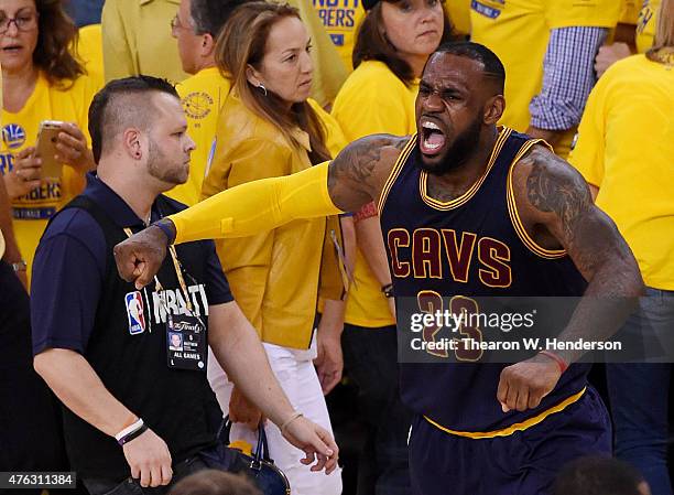LeBron James of the Cleveland Cavaliers celebrates their 95 to 93 win over the Golden State Warriors in overtime during Game Two of the 2015 NBA...