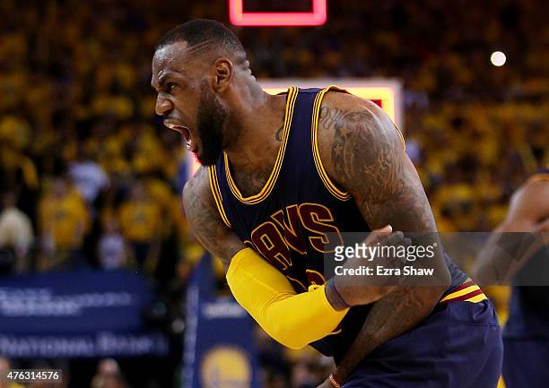 LeBron James of the Cleveland Cavaliers celebrates their 95 to 93 win over the Golden State Warriors in overtime during Game Two of the 2015 NBA...