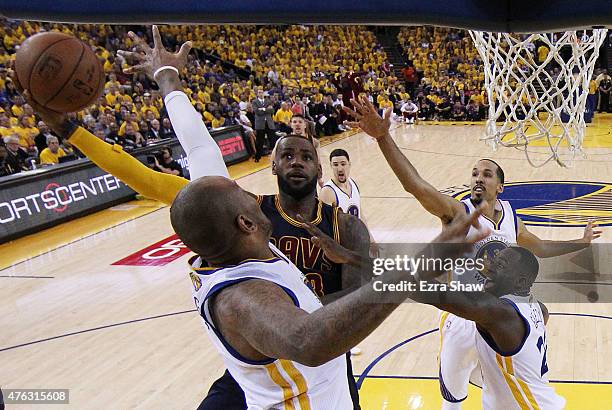 LeBron James of the Cleveland Cavaliers goes up against Marreese Speights of the Golden State Warriors in the second half during Game Two of the 2015...