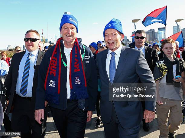 Neale Daniher and Prime Minister Tony Abbott walk to the MCG ahead of the round 10 AFL match between the Melbourne Demons and the Collingwood Magpies...