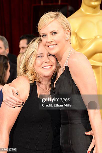 Actress Charlize Theron and Gerda Jacoba Aletta Maritz attend the Oscars held at Hollywood & Highland Center on March 2, 2014 in Hollywood,...