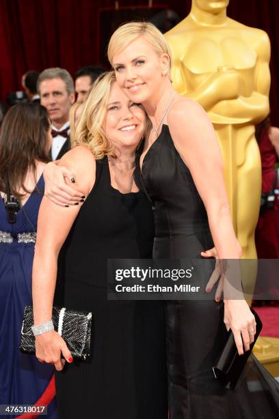 Actress Charlize Theron and Gerda Jacoba Aletta Maritz attend the Oscars held at Hollywood & Highland Center on March 2, 2014 in Hollywood,...