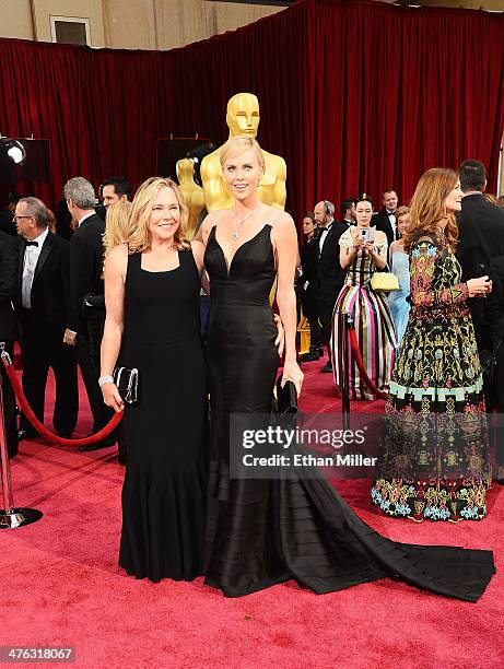 Actress Charlize Theron and mother Gerda Jacoba Aletta Maritz attend the Oscars held at Hollywood & Highland Center on March 2, 2014 in Hollywood,...