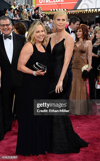 Actress Charlize Theron and Gerda Jacoba Aletta Maritz attend the Oscars held at Hollywood & Highland Center on March 2, 2014 in Hollywood,...