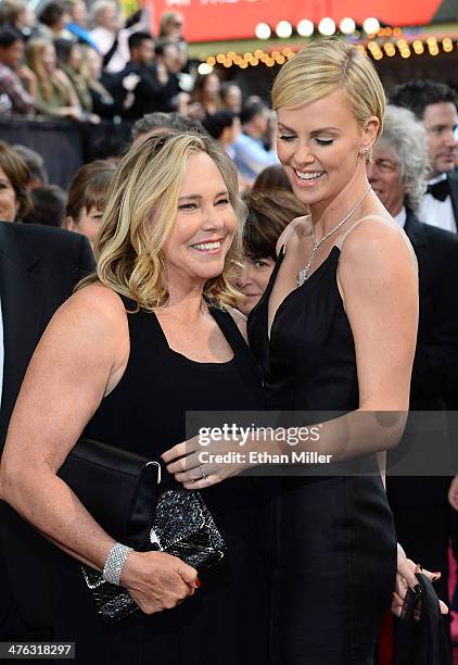 Actress Charlize Theron and Gerda Jacoba Aletta Maritz attend the Oscars held at Hollywood & Highland Center on March 2, 2014 in Hollywood,...