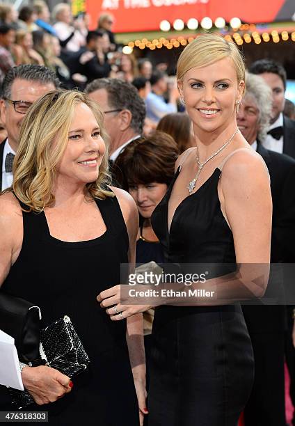 Actress Charlize Theron and Gerda Jacoba Aletta Maritz attend the Oscars held at Hollywood & Highland Center on March 2, 2014 in Hollywood,...