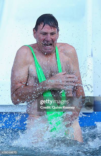 Sam Newman dives into an icebath to raise money for Motor Neurone Disease ahead of the round 10 AFL match between the Melbourne Demons and the...