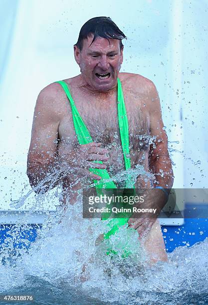 Sam Newman dives into an icebath to raise money for Motor Neurone Disease ahead of the round 10 AFL match between the Melbourne Demons and the...