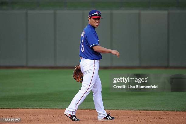 Kensuke Tanaka of the Texas Rangers plays second base in the eighth inning against the Chicago White Sox on March 2, 2014 in Surprise, Arizona.