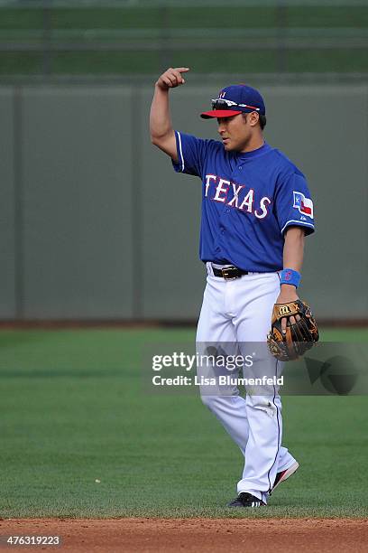 Kensuke Tanaka of the Texas Rangers plays second base in the eighth inning against the Chicago White Sox on March 2, 2014 in Surprise, Arizona.