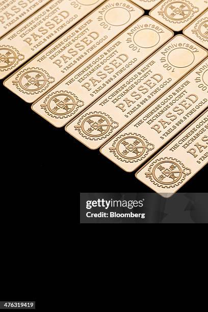 Five tael gold bars are arranged for a photograph at the Chinese Gold and Silver Exchange Society in Hong Kong, China, on Wednesday, Feb. 26, 2014....