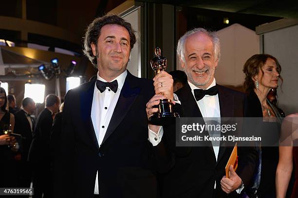Director Paolo Sorrentino celebrates with Actor Toni after winning Best Foreign Language Film for 'The Great Beauty' during the Oscars Governors Ball...