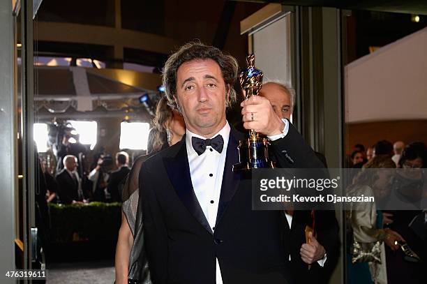 Director Paolo Sorrentino celebrates after winning Best Foreign Language Film for 'The Great Beauty' during the Oscars Governors Ball at Hollywood &...