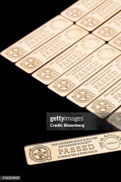 Five tael gold bars are arranged for a photograph at the Chinese Gold and Silver Exchange Society in Hong Kong, China, on Wednesday, Feb. 26, 2014....