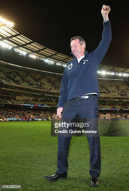 Neale Daniher waves to the crowd during the round 10 AFL match between the Melbourne Demons and the Collingwood Magpies at Melbourne Cricket Ground...