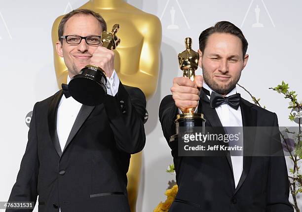 Film maker Laurent Witz and producer Alexandre Espigar pose in the press room during the Oscars at Loews Hollywood Hotel on March 2, 2014 in...