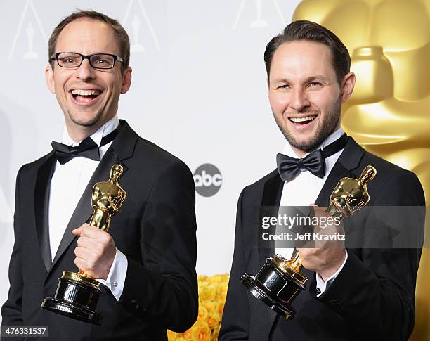 Film maker Laurent Witz and producer Alexandre Espigar pose in the press room during the Oscars at Loews Hollywood Hotel on March 2, 2014 in...