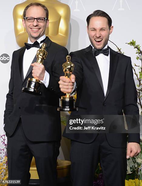 Film maker Laurent Witz and producer Alexandre Espigar pose in the press room during the Oscars at Loews Hollywood Hotel on March 2, 2014 in...