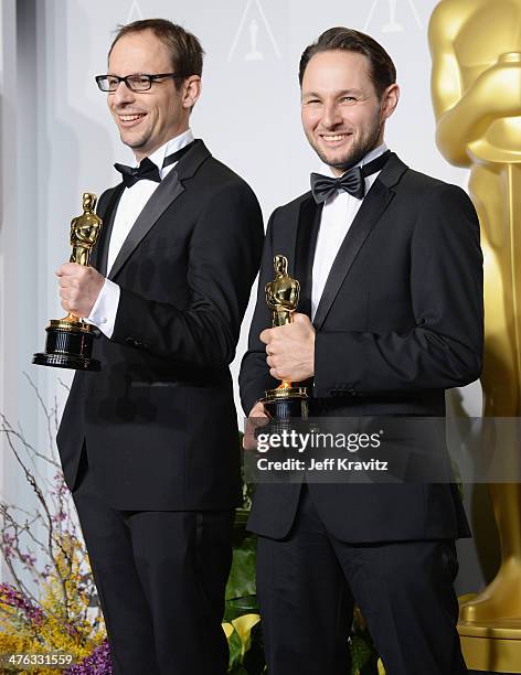 Film maker Laurent Witz and producer Alexandre Espigar pose in the press room during the Oscars at Loews Hollywood Hotel on March 2, 2014 in...