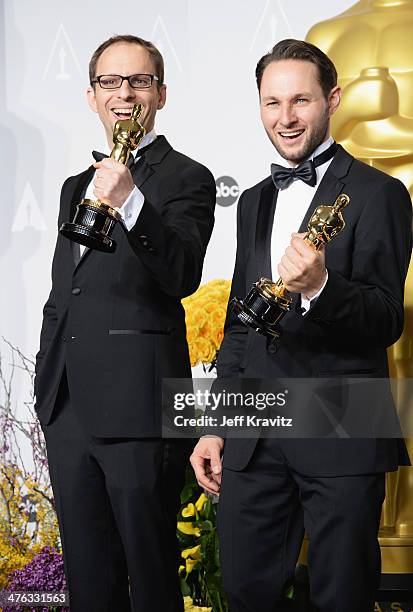 Film maker Laurent Witz and producer Alexandre Espigar pose in the press room during the Oscars at Loews Hollywood Hotel on March 2, 2014 in...