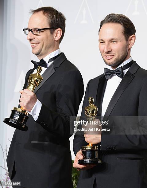 Film maker Laurent Witz and producer Alexandre Espigares pose in the press room during the Oscars at Loews Hollywood Hotel on March 2, 2014 in...