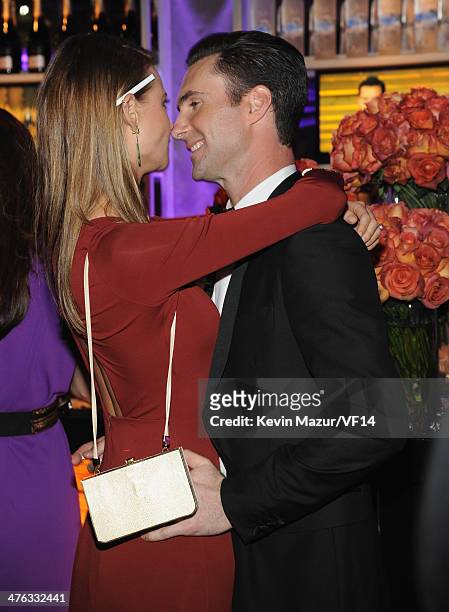 Behati Prinsloo and Adam Levine attend the 2014 Vanity Fair Oscar Party Hosted By Graydon Carter on March 2, 2014 in West Hollywood, California.
