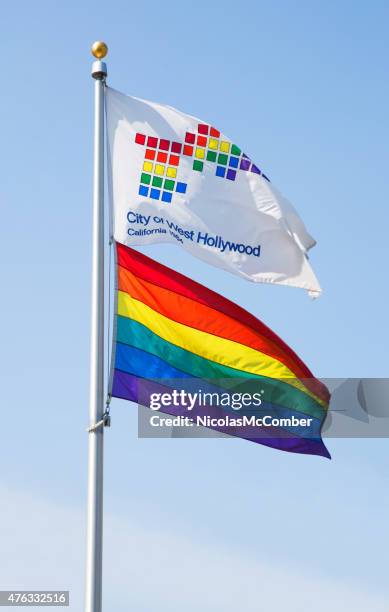 city of west hollywood and rainbow flags floating on pole - west hollywood pride stock pictures, royalty-free photos & images