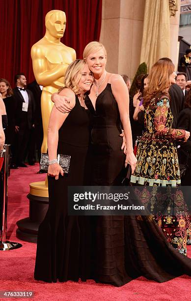 Actress Charlize Theron and Gerda Jacoba Aletta Maritz attend the Oscars held at Hollywood & Highland Center on March 2, 2014 in Hollywood,...