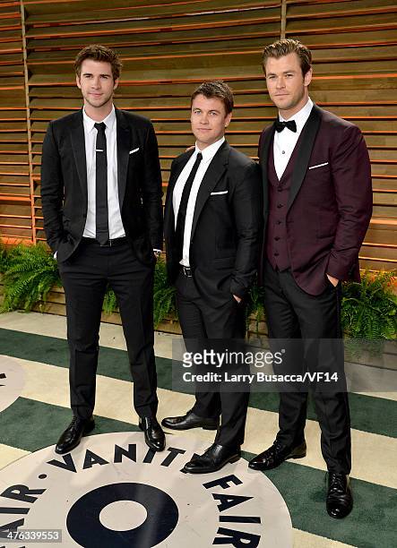 Actors Liam Hemsworth, Luke Hemsworth, and Chris Hemsworth attend the 2014 Vanity Fair Oscar Party Hosted By Graydon Carter on March 2, 2014 in West...