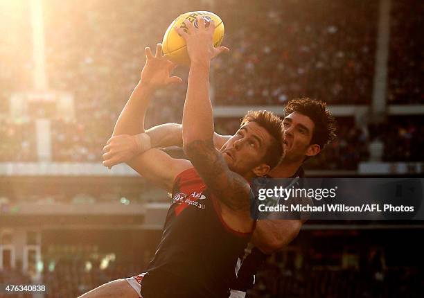 Jeremy Howe of the Demons and Tyson Goldsack of the Magpies compete for the ball during the 2015 AFL round ten match between the Melbourne Demons and...