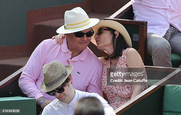 Alain Afflelou and his wife Christine Afflelou attend the men's final on day 15 of the French Open 2015 at Roland Garros stadium on June 56 2015 in...