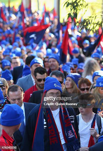 Neale Daniher leads the walk to the MCG ahead of the round 10 AFL match between the Melbourne Demons and the Collingwood Magpies at Melbourne Cricket...