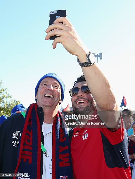 Neale Daniher poses with Russell Robertson walk to the MCG ahead of the round 10 AFL match between the Melbourne Demons and the Collingwood Magpies...