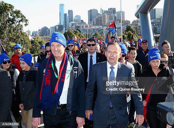 Neale Daniher and prime minister Tony Abbott walk to the MCG ahead of the round 10 AFL match between the Melbourne Demons and the Collingwood Magpies...