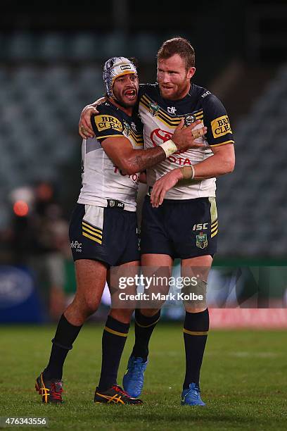 Johnathan Thurston and Gavin Cooper of the Cowboys celebrate victory during the round 13 NRL match between the Parramatta Eels and the North...