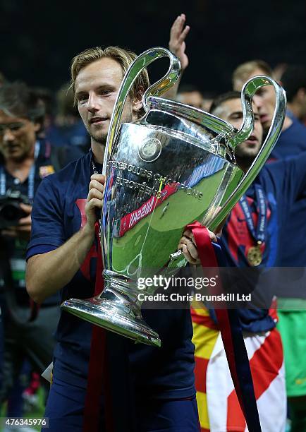 Ivan Rakitic of FC Barcelona celebrates with the trophy following the UEFA Champions League Final match between Juventus and FC Barcelona at the...