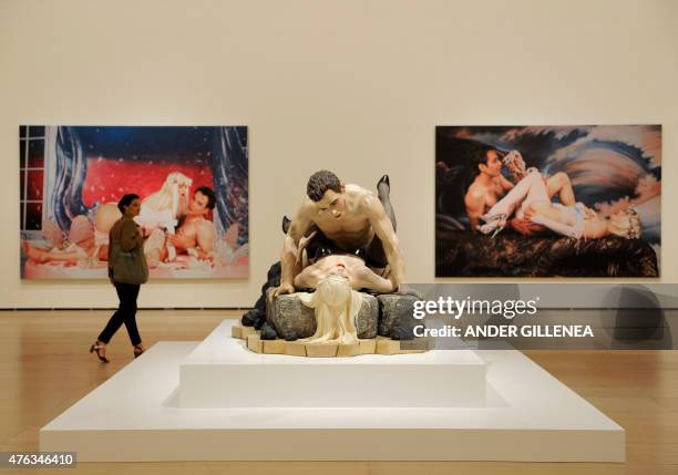 Woman passes by the US artist Jeff Koons' artworks titled "Made in Heaven" during the presentation of the "Jeff Koons: Retrospective" exhibition at...
