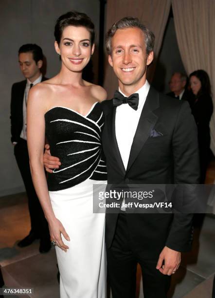 Actors Anne Hathaway and Adam Shulman attend the 2014 Vanity Fair Oscar Party Hosted By Graydon Carter on March 2, 2014 in West Hollywood, California.