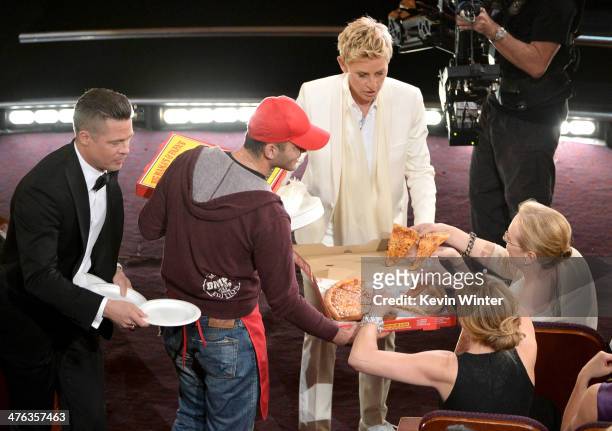 Host Ellen DeGeneres with actor Brad Pitt and actress Meryl Streep in the audience during the Oscars at the Dolby Theatre on March 2, 2014 in...