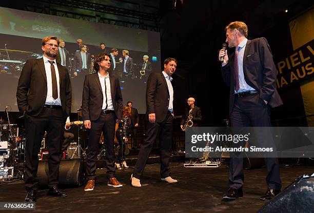 May 30: Head coach Juergen Klopp together with his assistant coaches Zeljko Buvac and Peter Krawietz during a speech of Hans-Joachim Watzke, CEO of...