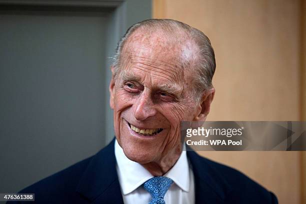Prince Philip, Duke of Edinburgh, smiles after unveiling a plaque at the end of his visit to Richmond Adult Community College in Richmond on June 8,...