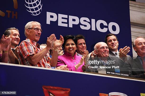 Indra K. Nooyi, Chairman and Chief Executive Officer of PepsiCo., rings the Opening Bell with other executives at the New York Stock Exchange on June...