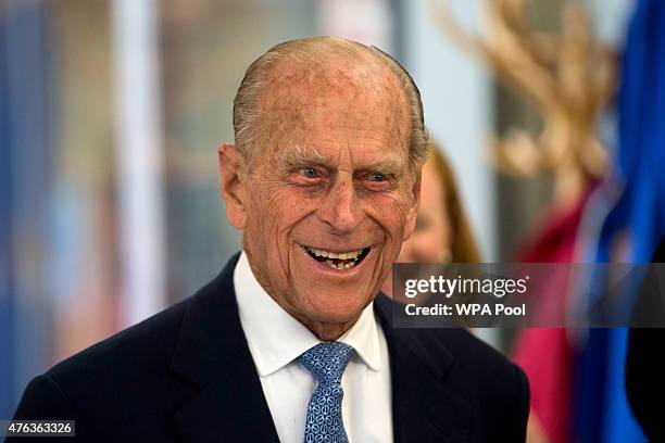 Prince Philip, Duke of Edinburgh, smiles as he meets people in the print making studio during his visit to Richmond Adult Community College in...